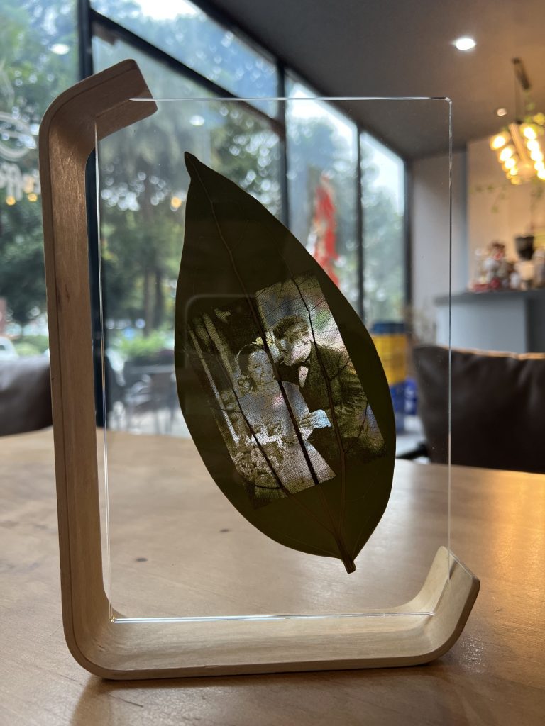 wedding photo printed on leaf in floating frame.